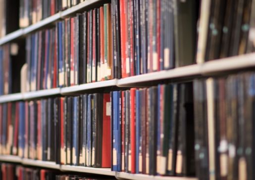 library shelves of journals and books