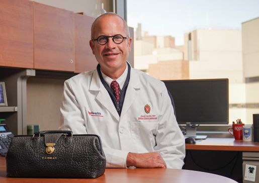 Dr. David Andes sits at his desk